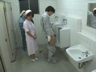 Asian Cleaning Lady Helps Patient In A Toilet